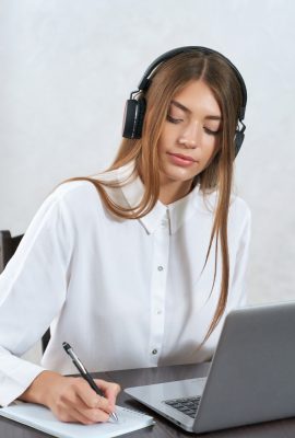 charming-woman-listening-online-coursesjpg
